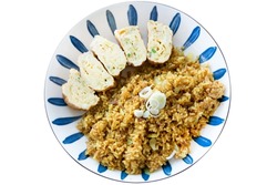 Top view of Fried rice curry with rolled egg thai style, focus selective