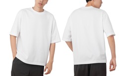 Young man in blank oversize t-shirt mockup front and back used as design template, isolated on white background with clipping path.