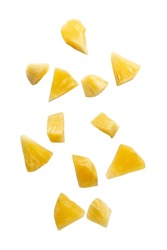 Falling pineapple slices isolated on white background with clipping path.