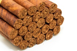 Cuban Cigars: Luxury hand made Cuban cigars on a white background. Bundles of 25 sticks. Symbol of wealth and expensive habits. 