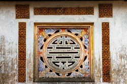 Ceramic Decorative Art On The Wall Of A Palace In Hue Imperial Citadel. The Imperial Citadel Of Hue, A UNESCO Cultural Heritage Is A Major Tourist Destination In Vietnam.