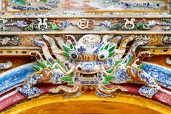 Detail Of Ceramic Mosaic Dragon Of A Palace In Hue Imperial Citadel. Hue Imperial Citadel, A UNESCO Cultural Heritage Is A Major Tourist Destination In Vietnam.
