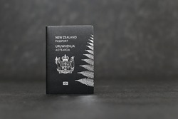 New Zealand passport on black background