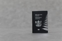 New Zealand passport on gray background
