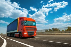 Red truck on highway - business, commercial, cargo transportation concept