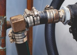 Pressure pump plumbing including hoses, clamps and ninety degree elbow