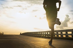 Man running jogging on bridge road. Health activities, Exercise by runner.