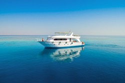 White yacht on the azure water of the Red Sea.
