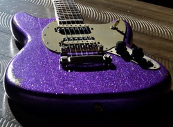 Old Purple Sparkle Electric Guitar in Sunlight