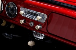Dashboard of a stylish classic passenger car. The excellent restoration of the vehicle with nice details of the interior