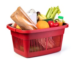 Plastic shopping basket with of grocery products isolated on white