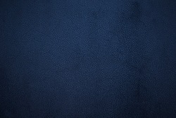Old dark blue faux leather. Background. Texture.