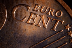 Close-up of a euro cent coin. Close-up of loose change cent euro coins on table. Euro coin with selective focus