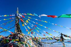 The colourful flags at mountain summit