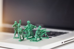 toy soldiers protect  computer from hacker attacks.