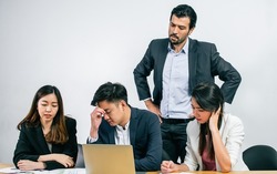 Group of business people is upset and getting stress about their unsuccessful project while their boss complaining. Working and Failure Concept