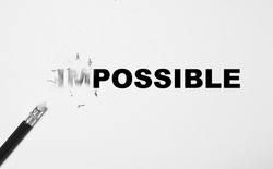 Rubber on pencil rub wording form impossible to possible for positive thinking mindset concept.