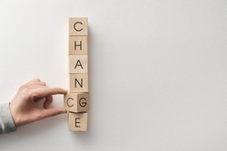 Wooden cubes with inscriptions: chance and change. Changes and new chances in a person's life