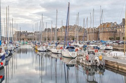 Boats and yachts in the port of historical city Saint Malo, Brittany, France