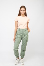 girl in green cargo pants and a t-shirt