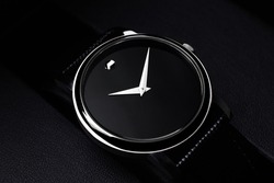 Black luxury watch on black background