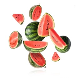 Fresh raw watermelon falling in the air isolated on white background. Food levitation or zero gravity conception. igh resolution image.