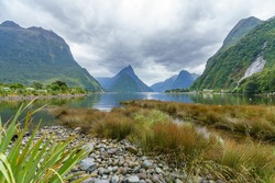 towering peaks at natural wonder milford sound in fjordland national park in southland in new zealand