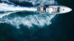 Aerial drone top view photo of luxury inflatable rib speed boat cruising in high speed in mediterranean deep blue sea