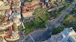 Aerial drone photo of iconic Imperial Fora - public squares forming the center of the Roman Empire and famous Trajan's Column, Rome historic centre, Italy