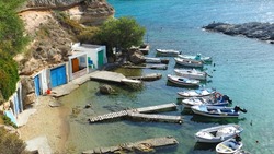 Beautiful fishermen seaside village of Mandrakia with colourful boat houses called 