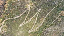 Aerial drone top down serpentine mountain scenic zig zag road with 