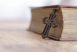 Close-up of bible has a cross , the concept of belief and faith. With copy spaces
