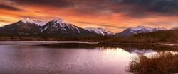 Panorama of Mountains illuminated by sunset in Banff National Park. The vermillion lakes, a destination for outdoor activities like paddling and seeing wildlife in the canadian rockies