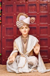 Statue of Indian Lord Swaminarayan blessing wallpaper design