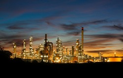 Oil​ refinery​ and​  plant and tower column of Petrochemistry industry in oil​ and​ gas​ ​industrial with​ cloud​ orange​ ​sky the sunrise​ background​