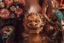 Imperial guardian lion sculpture wood, At worship of temple Chinese people in Thailand.
