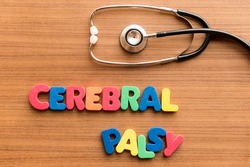 cerebral palsy colorful word on the wooden background with stethoscope