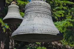 Close up view of old church bells with decorative elements