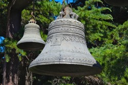 Close up view of old church bells with decorative elements
