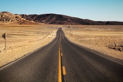Road in Death Valley surrounded by the desert