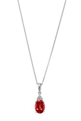 Silver diamond pendant necklace with red precious stone on white background