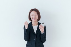 Portrait of a business woman in front of a white wall