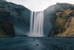 A long exposure photo of Icelandic waterfall called Skogafoss during the COVID outbreak without people