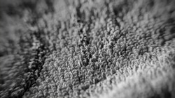 fleecy carpet texture fragment, monochrome, macro, blurred image 