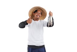 An Asian local fisherman standing in front white background. Holding some fish using his hand. Close up.