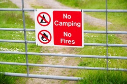 No camping no fire sign on entrance gate