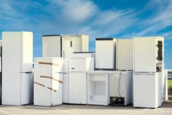 Old fridges freezers wash machines and kitchen appliances at rubbish dump