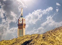 Beautiful view of Makkah Tower, Clock Tower top view and dry mountains of holy city of Makkah, Saudi Arabia
