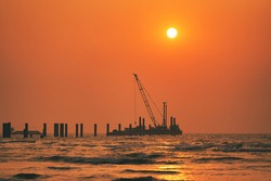 Sea Beach Sunset and Construction
