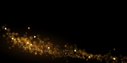 Abstract luxury background with gold glitter lights. Glowing dust on black. Defocused golden particles.